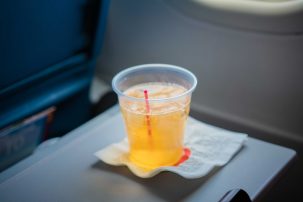 An ex-flight attendant explains how to get free drinks on a flight