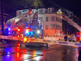 Firefighters battle heavy flames in apartment building