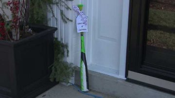 Wisconsin families are placing baseball bats outside their homes to honor one of the Christmas parade victims
