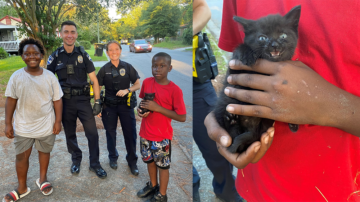 Caught on camera: Police officers help two boys save kitten from storm drain