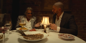 Bad Bunny Dines With Al Pacino in New “Monaco” Video: Watch