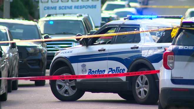 boston police vehicle with crime tape