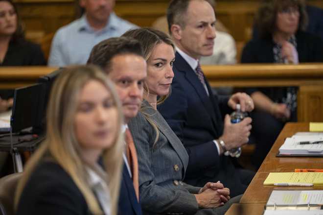 Defendant Karen Read sits at the defense table during her murder trial, Thursday, May 2, 2024, in Dedham, Mass. Read, 44, of Mansfield, faces several charges including second degree murder in the death of her Boston Police officer boyfriend John O’Keefe, 46, in 2022. (David McGlynn/New York Post via AP, Pool)