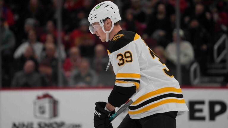 Morgan Geekie skates to the bench after scoring on the Blackhawks.