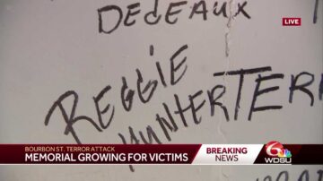 Emotional video shows residents write names of terror attack victims