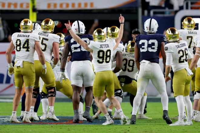 Mitch Jeter of the Notre Dame Fighting Irish celebrates after kicking the game-winning field goal during the fourth quarter against the Penn State Nittany Lions in the Capital One Orange Bowl.