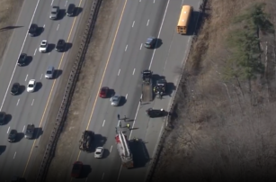 School bus damaged, SUV rolled over, following crash on I-93 in Mass.