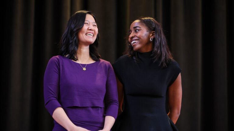 Boston Mayor Michelle Wu, left, and Emmy-winning actor Ayo Edebiri share a moment of laughter during their visit to Boston Latin School on Thursday. Edebiri, a Boston Public Schools alumna, returned to participate in a conversation with students where she reflected on growing up in Boston and how her education influenced her career.