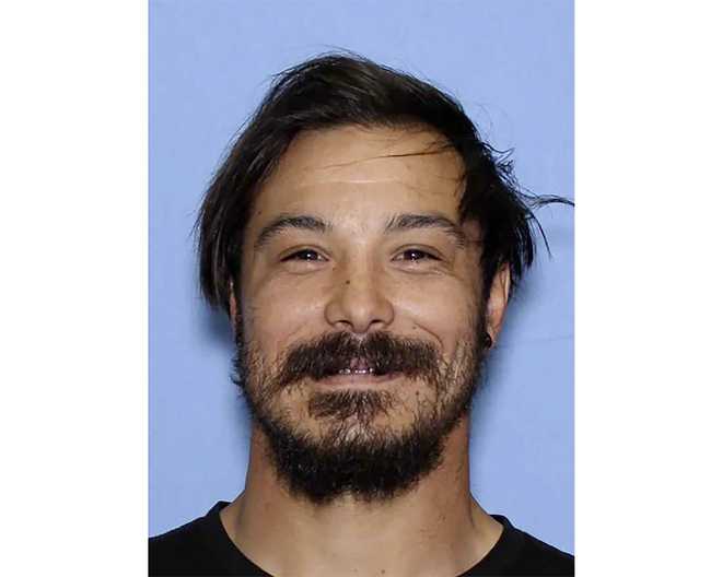 FILE - This undated photo provided by the Wenatchee Police Department shows Travis Caleb Decker, who is wanted in connection with the deaths of his three daughters.