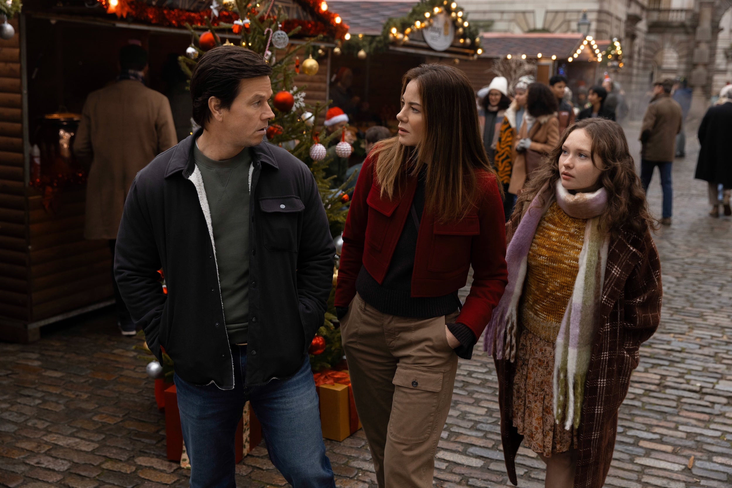 2025 holiday movies: Mark Wahlberg, Michelle Monaghan and Zoe Colletti in "The Family Plan 2," streaming November 21, 2025 on Apple TV.