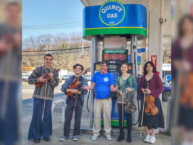 Violists serenade customers at Quincy Gas