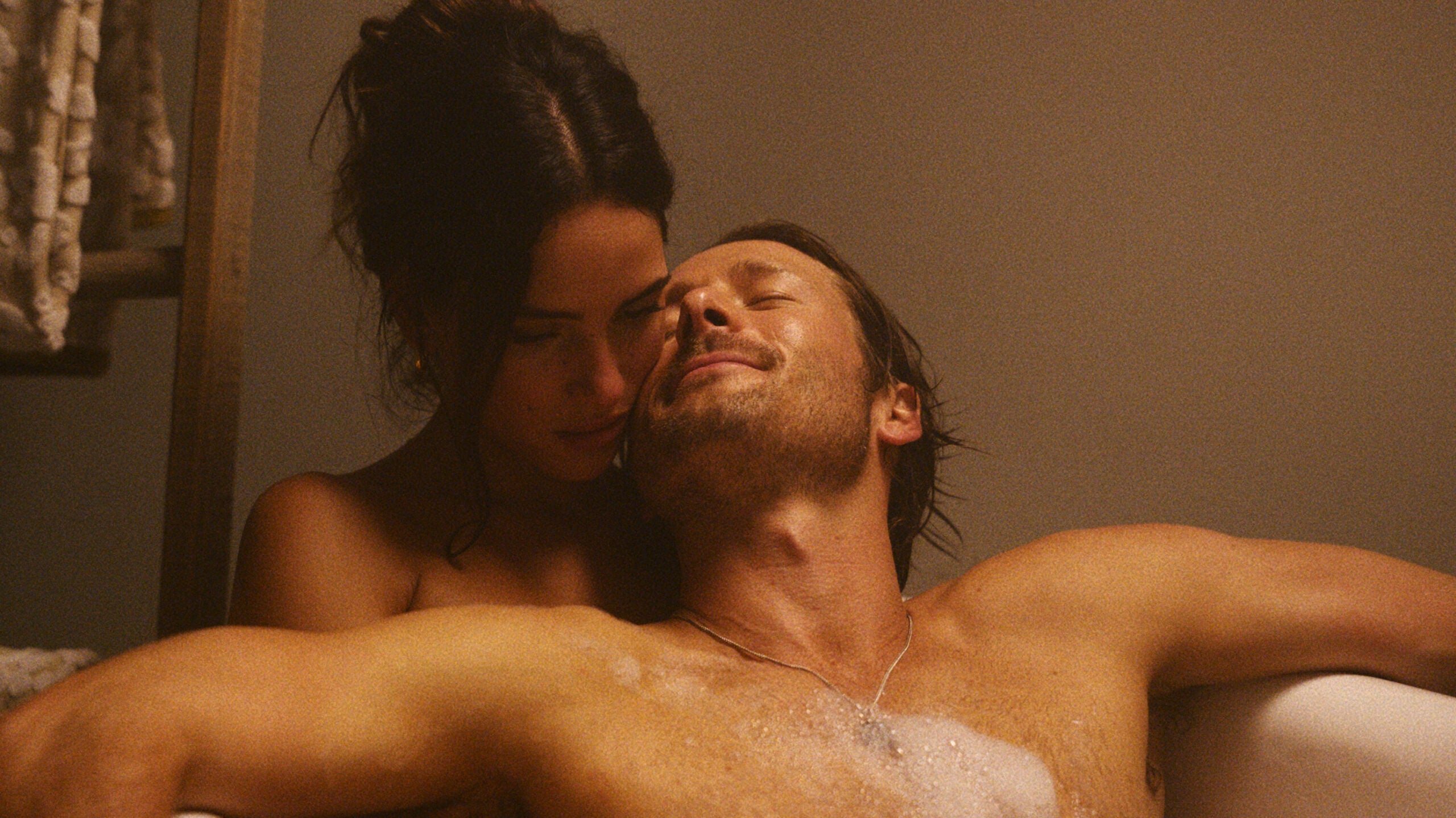 Adria Arjona and Glen Powell in "Hit Man."